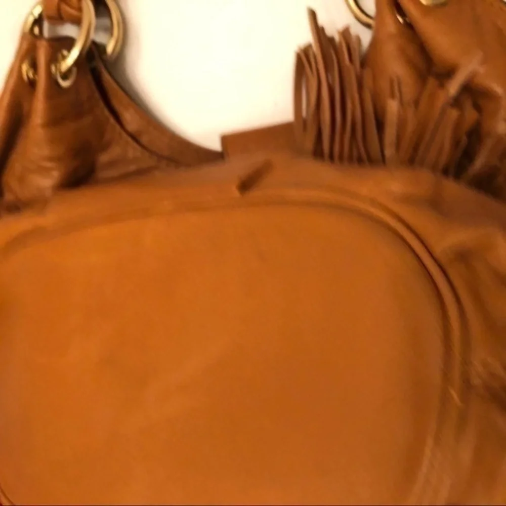 Michael kors brown leather grommet tassel bag